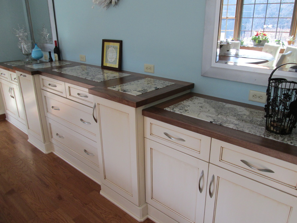 Mid-sized transitional light wood floor kitchen/dining room combo photo with blue walls and no fireplace