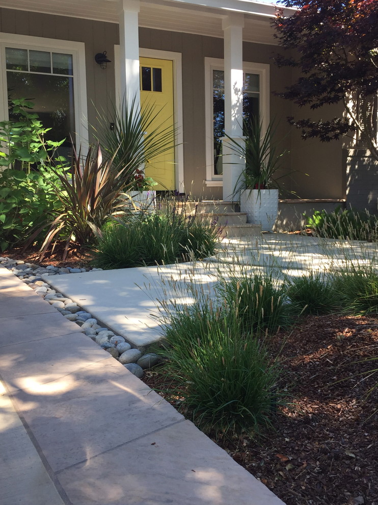 Mid-sized contemporary front yard partial sun garden in San Francisco with natural stone pavers.