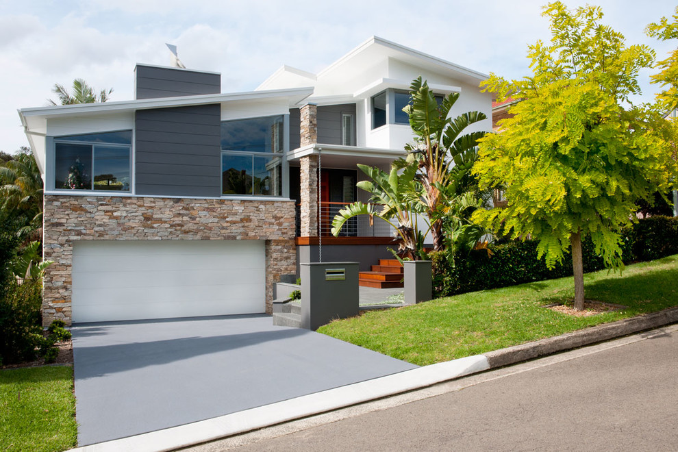 Contemporary split-level exterior in Sydney with a shed roof.
