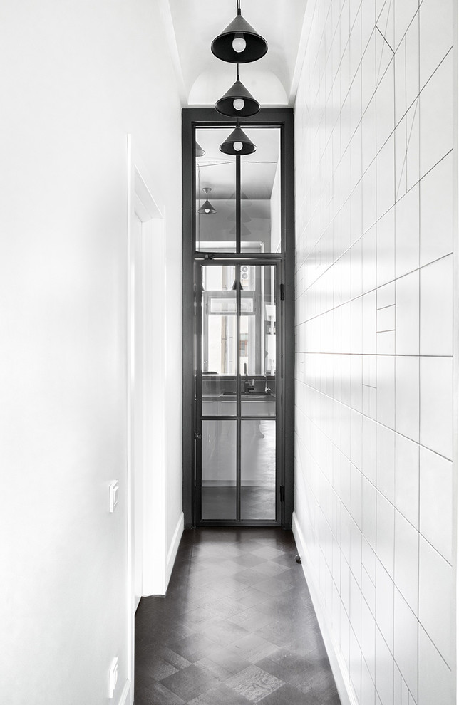 Design ideas for a contemporary hallway in Moscow with white walls and black floor.