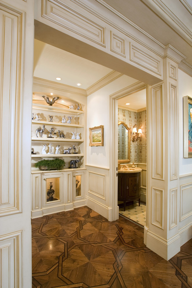Photo of a traditional hallway in Los Angeles with white walls and medium hardwood floors.