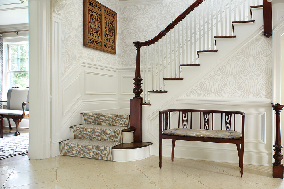 Entry - A light filled entry utilizing antique pieces with updated upholstery. Photography by Peter Rymwid.