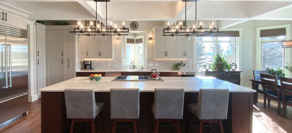 Example of a large transitional single-wall dark wood floor, brown floor and coffered ceiling eat-in kitchen design in Calgary with an undermount sink, shaker cabinets, gray cabinets, quartzite countertops, white backsplash, stainless steel appliances, an island and white countertops