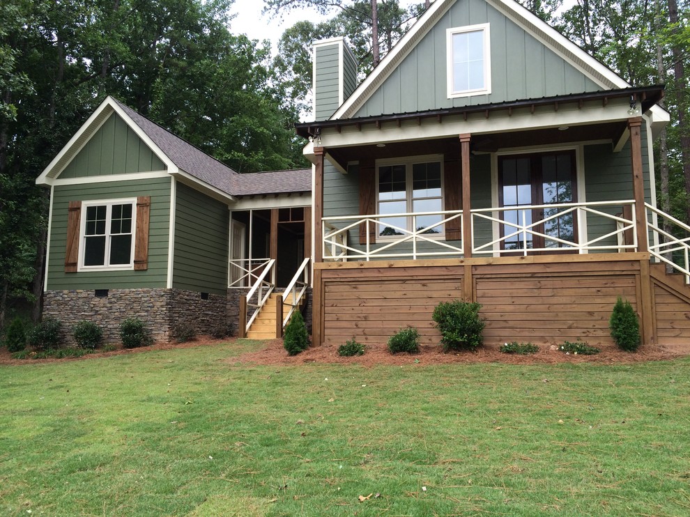Inspiration for a mid-sized country two-storey green exterior in Atlanta with mixed siding and a gable roof.