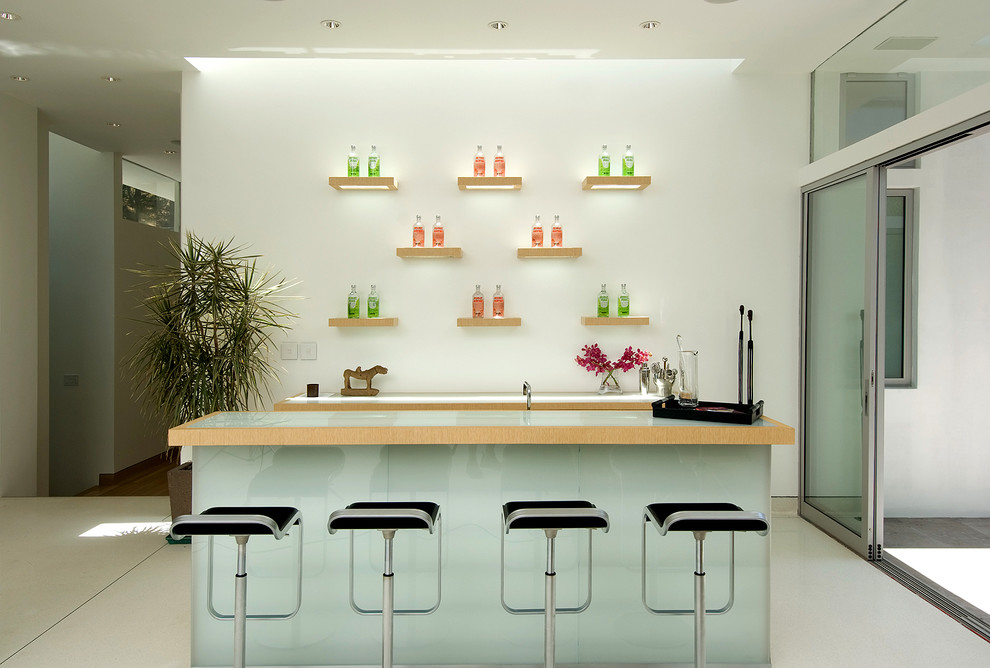 Design ideas for a contemporary galley seated home bar in Los Angeles.