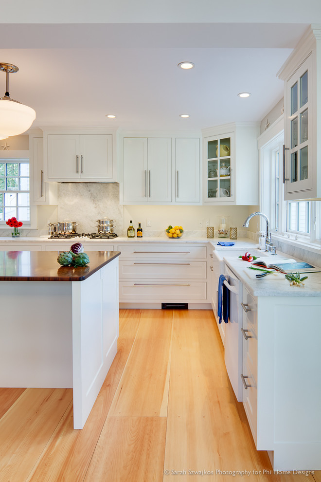 Inspiration for a transitional kitchen remodel in Portland Maine with white cabinets