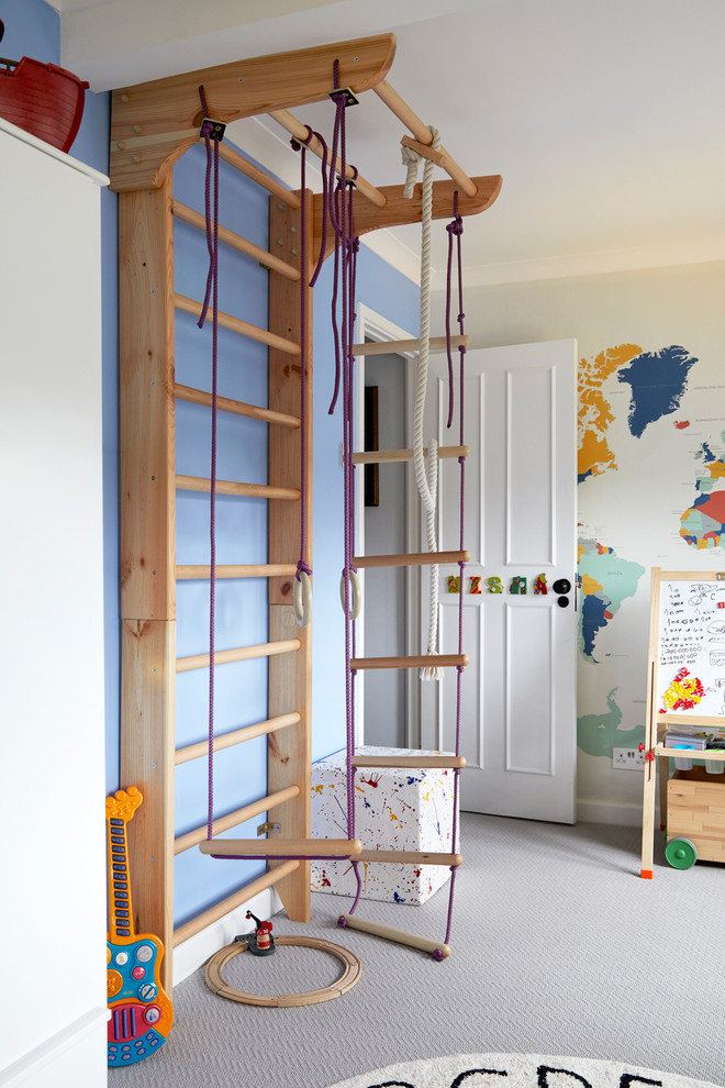 Design ideas for a mid-sized transitional gender-neutral kids' bedroom for kids 4-10 years old in London with carpet and grey floor.