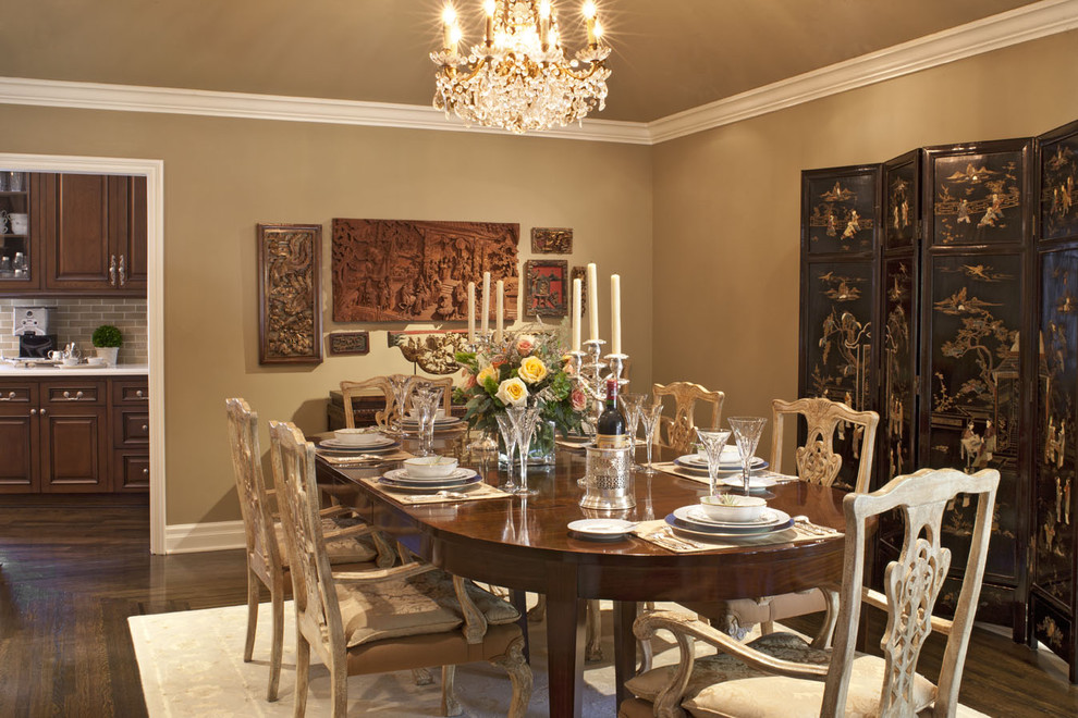 Photo of a mid-sized traditional separate dining room in Los Angeles with dark hardwood floors, beige walls, no fireplace and brown floor.