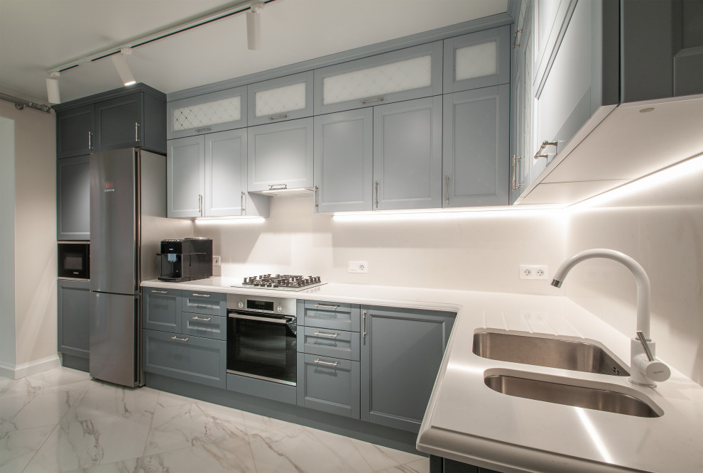 This is an example of a mid-sized traditional l-shaped separate kitchen in Moscow with glass-front cabinets, grey cabinets, quartz benchtops, white splashback, engineered quartz splashback and white benchtop.