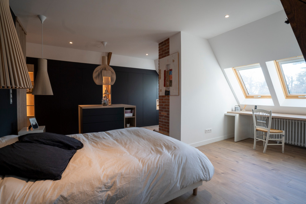 This is an example of a large traditional bedroom in Angers.