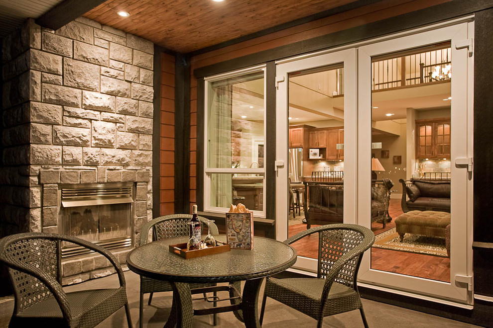 This is an example of a traditional patio in Vancouver with a fire feature.