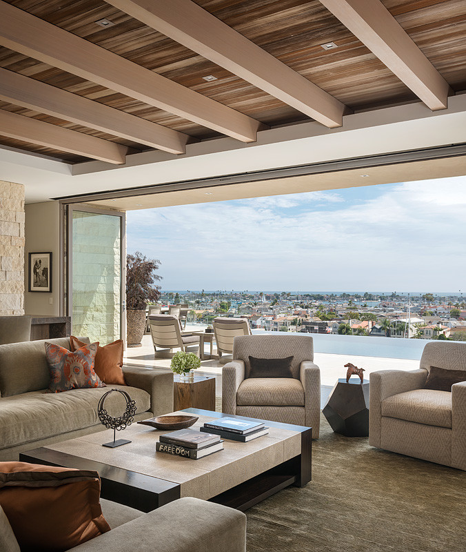 This is an example of a contemporary open concept family room in Orange County with beige walls.