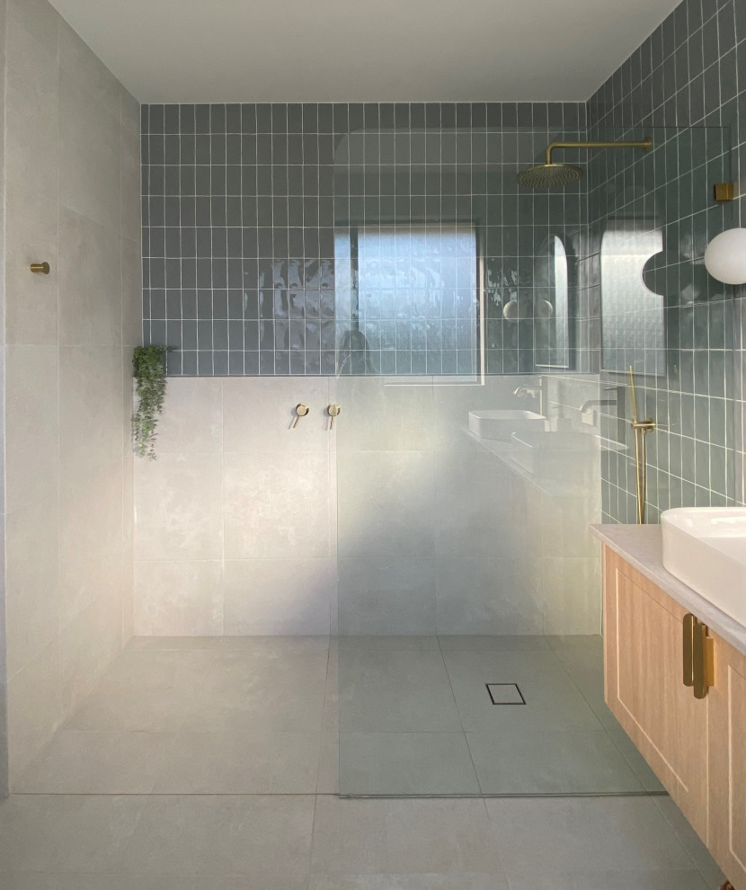 Inspiration for a large modern master bathroom with shaker cabinets, light wood cabinets, a freestanding tub, an open shower, a one-piece toilet, white tile, mosaic tile, grey walls, cement tiles, a console sink, concrete benchtops, an open shower, grey benchtops, a double vanity and a floating vanity.