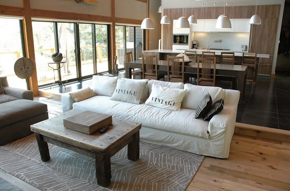 Inspiration for a large rustic galley dark wood floor open concept kitchen remodel in Boston with an undermount sink, shaker cabinets, white cabinets, granite countertops, stainless steel appliances and an island