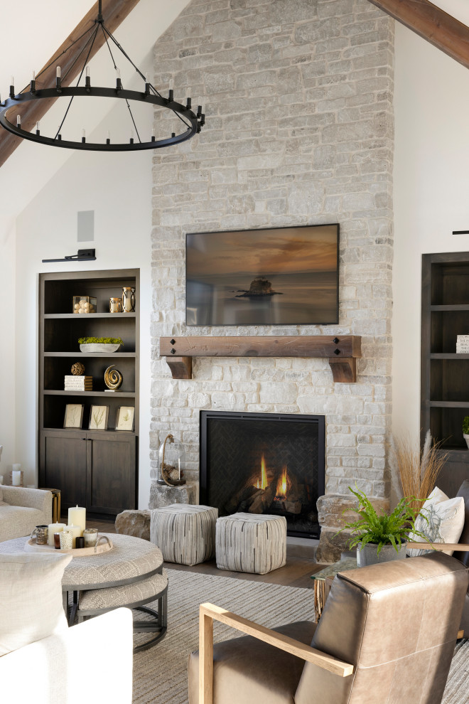 Photo of a modern living room in Minneapolis with a stone fireplace surround.