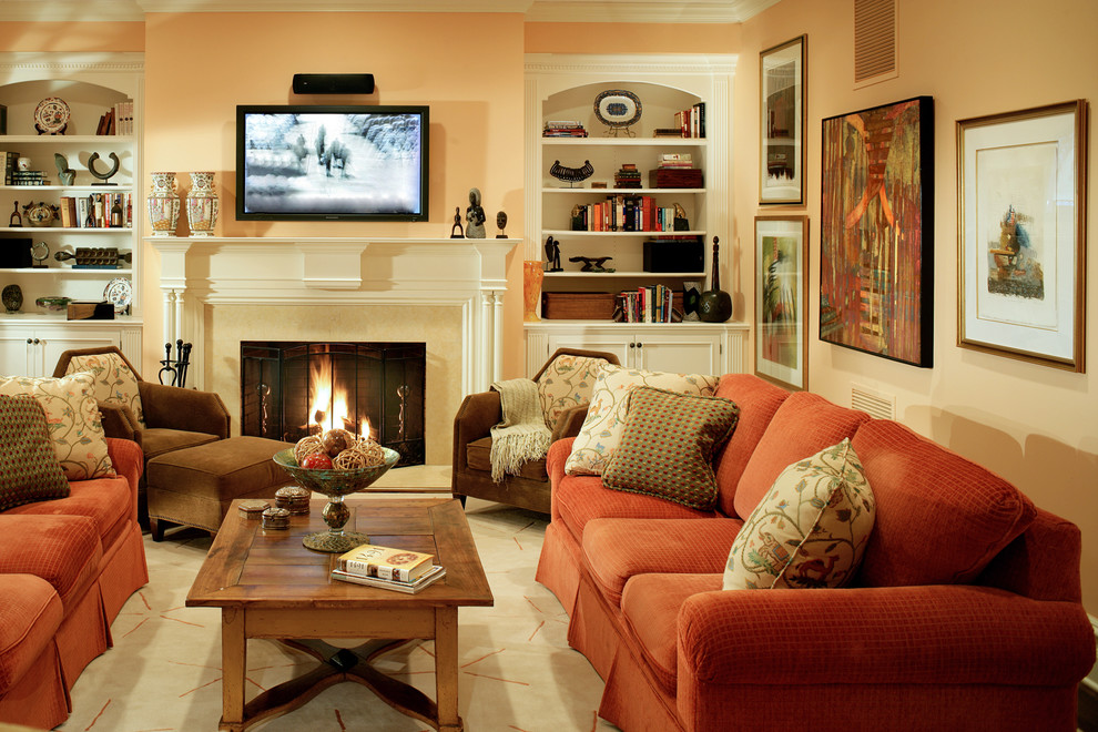 Mid-sized traditional enclosed living room in New York with beige walls, a standard fireplace, a plaster fireplace surround and a wall-mounted tv.