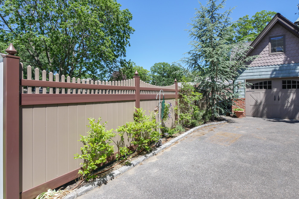 Photo of a modern garden in New York with a vinyl fence.