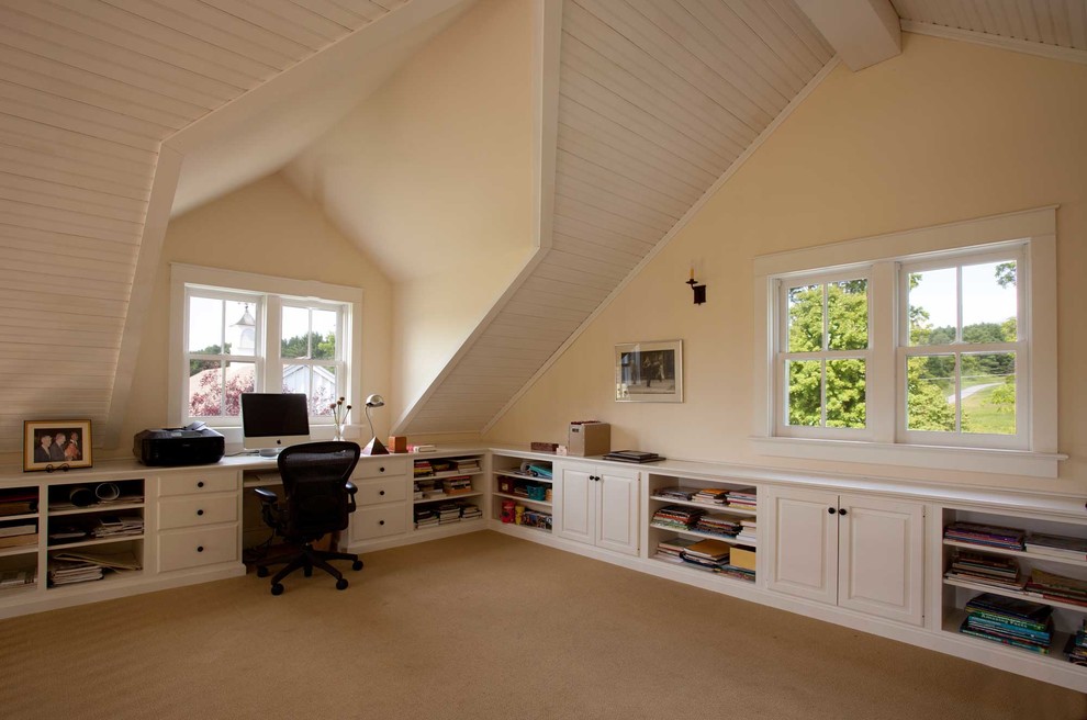 Mid-sized country study room in Boston with beige walls, carpet, no fireplace and a built-in desk.