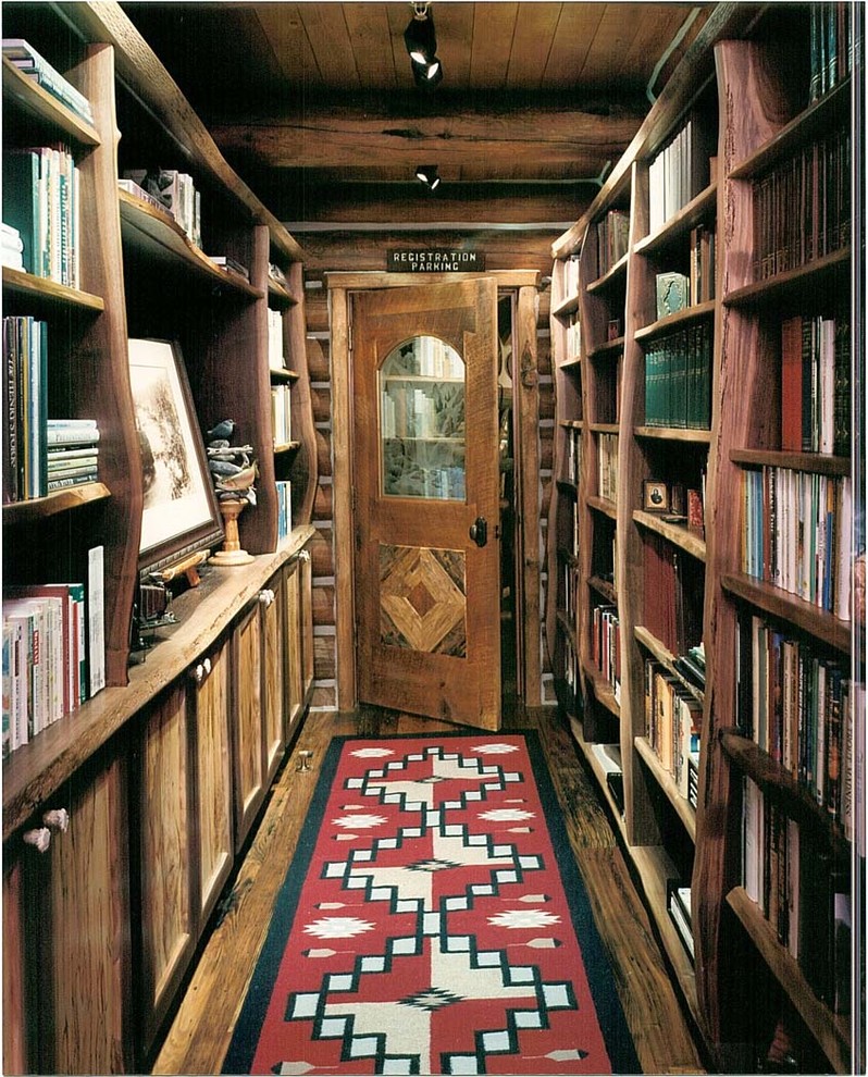 Hallway - large rustic medium tone wood floor hallway idea