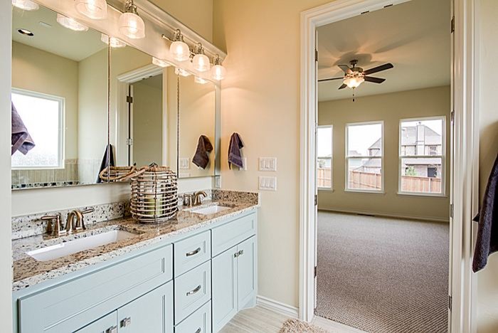 Large arts and crafts master bathroom in Oklahoma City with a drop-in sink, furniture-like cabinets, blue cabinets, quartzite benchtops, beige tile and beige walls.