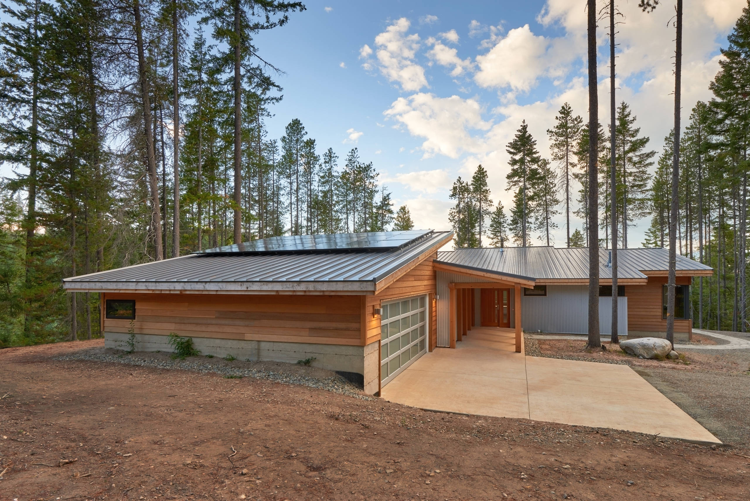 View of roofline, including solar panels on garage roof.