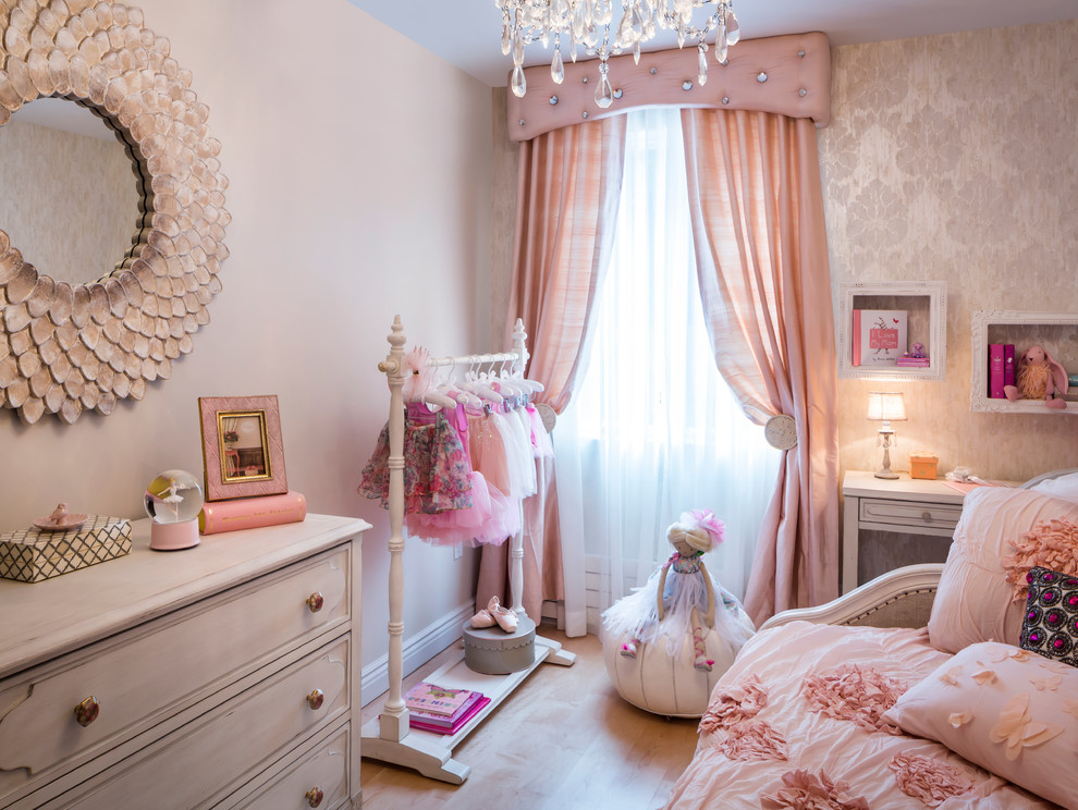 Design ideas for a mid-sized traditional kids' bedroom for kids 4-10 years old and girls in New York with light hardwood floors and multi-coloured walls.
