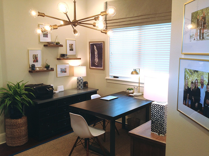 Inspiration for a small transitional home office in Orlando with beige walls, medium hardwood floors, no fireplace, a freestanding desk and brown floor.