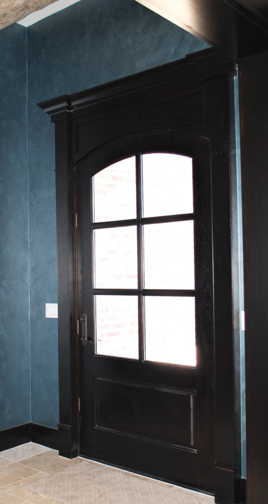 Inspiration for a rustic single front door remodel with a dark wood front door