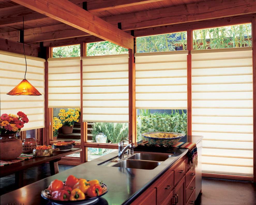 Example of a mid-sized transitional galley eat-in kitchen design with a double-bowl sink, shaker cabinets, dark wood cabinets and soapstone countertops