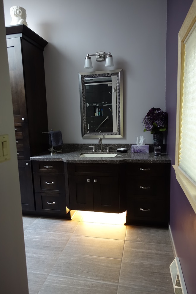 Example of a large transitional master ceramic tile porcelain tile bathroom design with shaker cabinets, dark wood cabinets, purple walls and an undermount sink