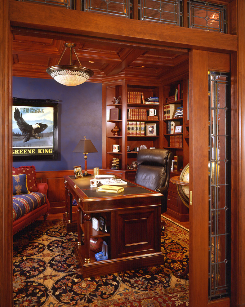 Design ideas for a traditional study room in San Francisco with medium hardwood floors, blue walls, no fireplace and a freestanding desk.