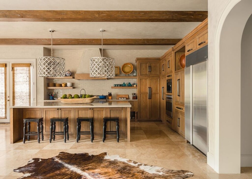 This is an example of a large traditional l-shaped eat-in kitchen in Houston with recessed-panel cabinets, medium wood cabinets, beige splashback, subway tile splashback, stainless steel appliances, travertine floors, with island and brown floor.