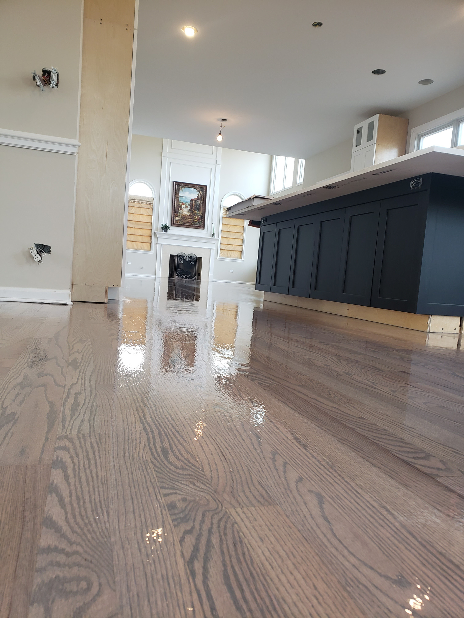 New 2 and 1/4 red oak flooring installed and old flooring refinished