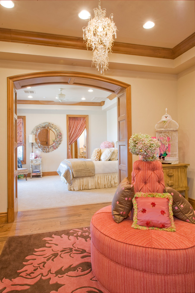Inspiration for a mediterranean bedroom in Las Vegas with beige walls and medium hardwood floors.