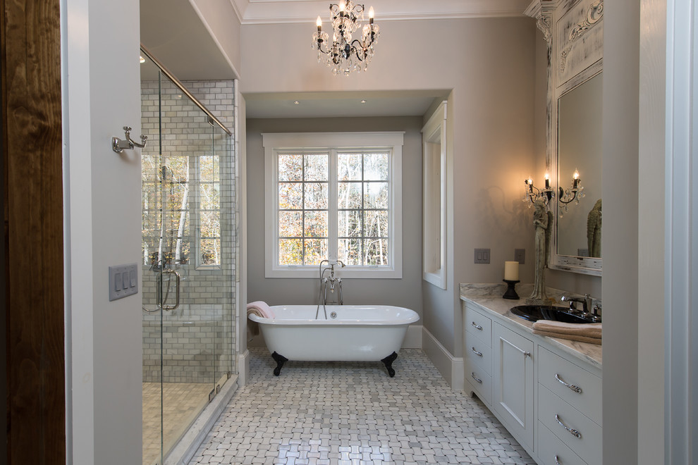 Design ideas for a large traditional master bathroom in Other with flat-panel cabinets, grey cabinets, a claw-foot tub, gray tile, marble, grey walls, marble floors and marble benchtops.