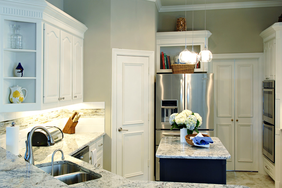 Large transitional u-shaped eat-in kitchen photo in Dallas with white cabinets, granite countertops, multicolored backsplash, matchstick tile backsplash, stainless steel appliances and an island