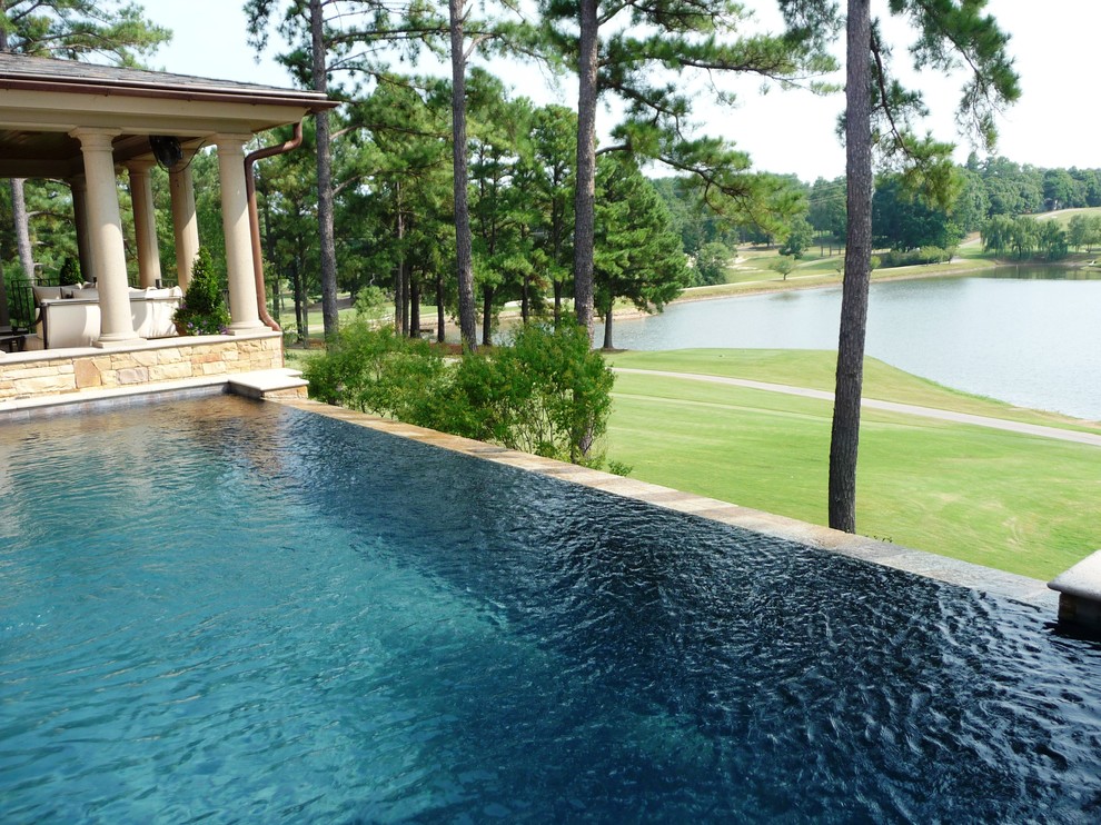 Design ideas for a transitional backyard rectangular infinity pool in Raleigh.