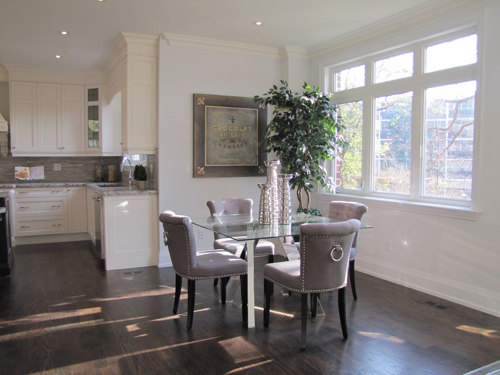 This is an example of a mid-sized contemporary open plan dining in Toronto with white walls, dark hardwood floors and no fireplace.