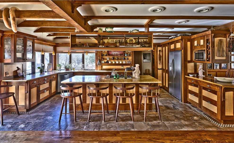 Large arts and crafts u-shaped eat-in kitchen in New York with stainless steel appliances, with island, an undermount sink, shaker cabinets, dark wood cabinets, granite benchtops and vinyl floors.