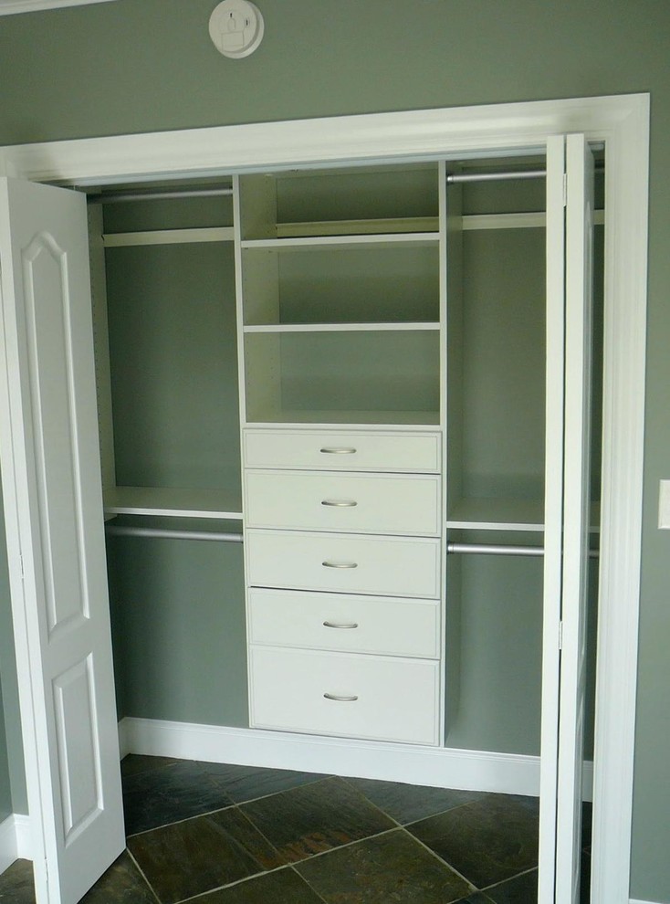 Design ideas for a mid-sized transitional gender-neutral built-in wardrobe in Boston with open cabinets, white cabinets, porcelain floors and black floor.