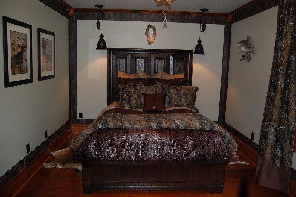 Inspiration for a mid-sized country guest bedroom in Other with green walls and dark hardwood floors.