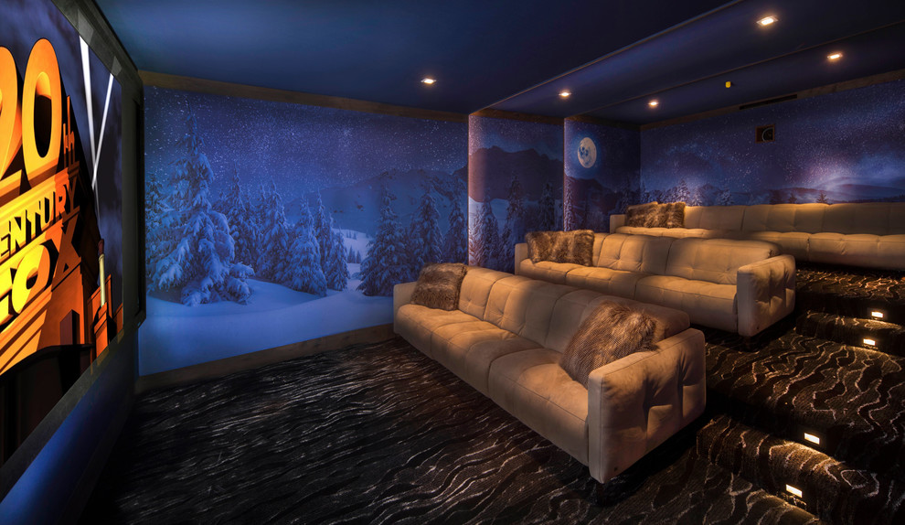 This is an example of a large contemporary enclosed home theatre in Other with blue walls, carpet, black floor and a projector screen.
