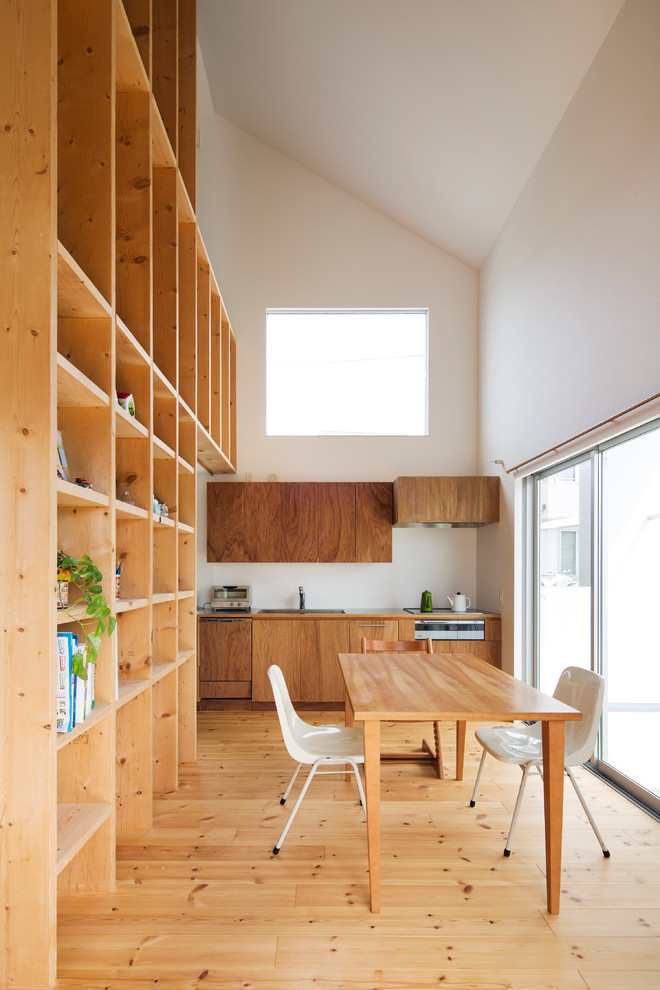 Photo of a contemporary kitchen/dining combo in Tokyo Suburbs with white walls, light hardwood floors and no fireplace.