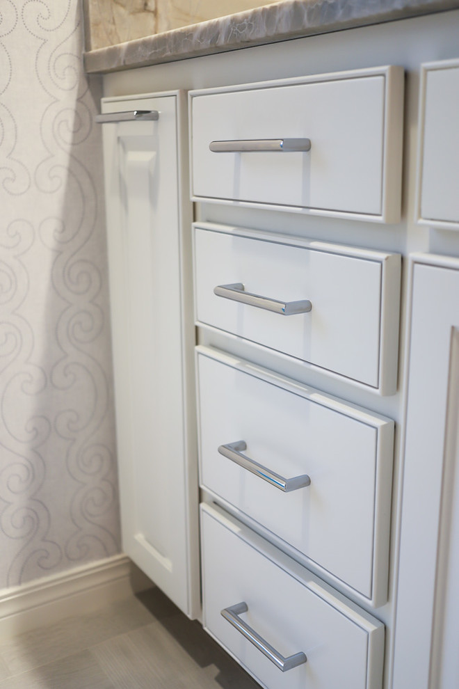 Example of a mid-sized transitional master white tile and marble tile ceramic tile and gray floor alcove bathtub design with gray walls, beaded inset cabinets, white cabinets, a two-piece toilet, an undermount sink, quartzite countertops and a hinged shower door