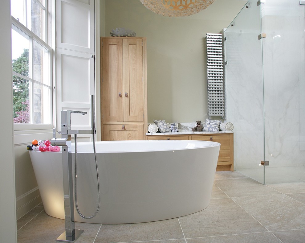 This is an example of a large transitional bathroom in Edinburgh with shaker cabinets and medium wood cabinets.