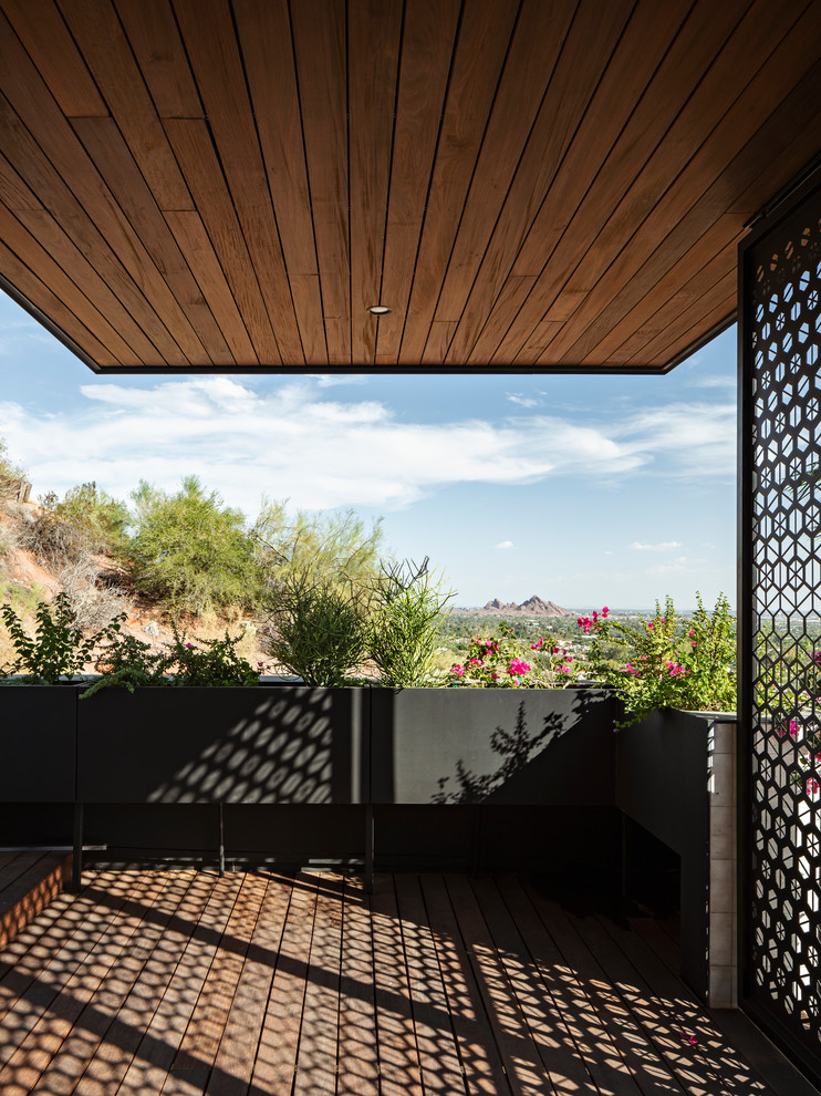 Deck - modern deck idea in Phoenix with a roof extension