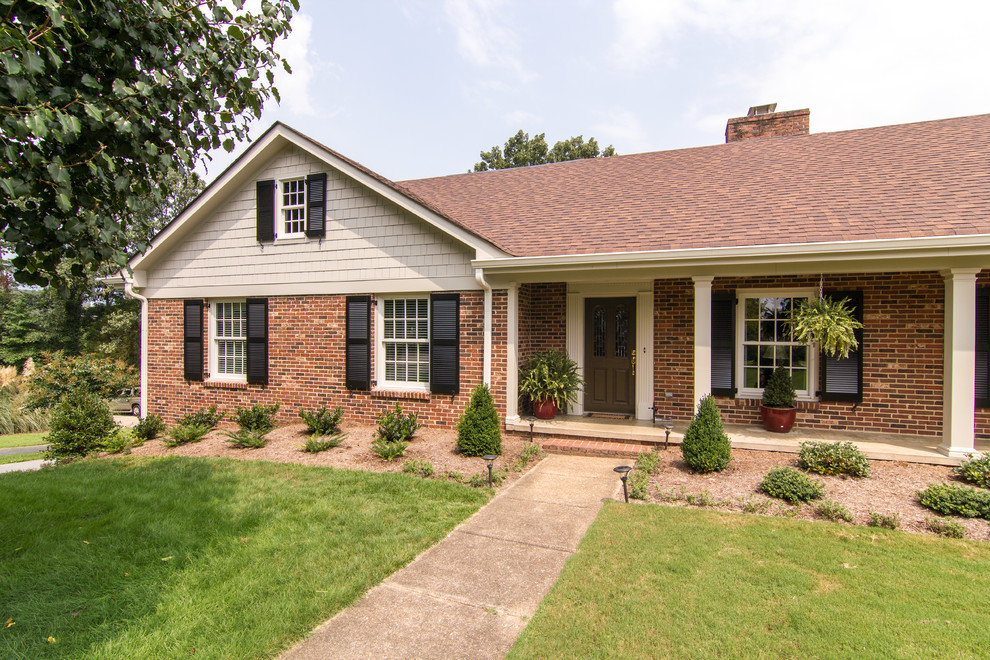 Large elegant red one-story brick gable roof photo