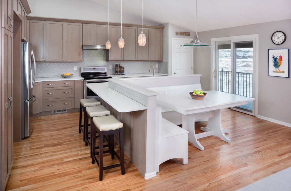 Example of a transitional kitchen design in Denver