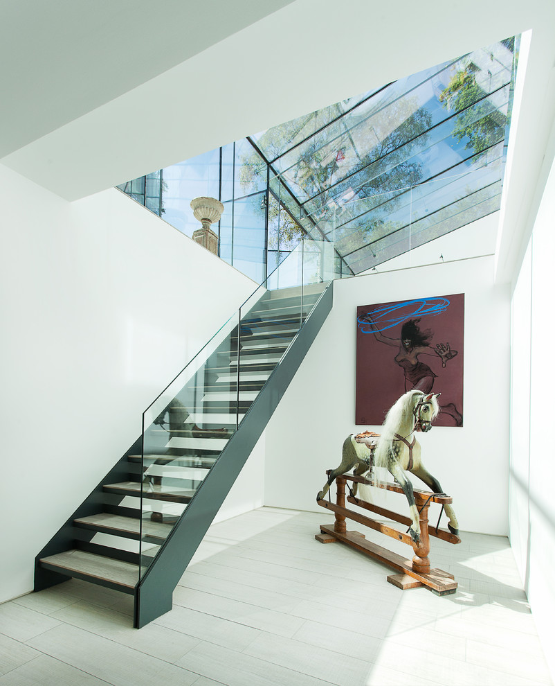 Contemporary straight staircase in Other with open risers.