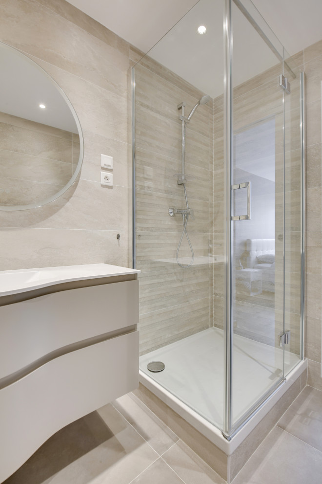 Small contemporary 3/4 bathroom in Paris with beaded inset cabinets, beige cabinets, a corner shower, a wall-mount toilet, beige tile, ceramic tile, concrete floors, a console sink, beige floor, a hinged shower door, white benchtops, a niche, a single vanity, a built-in vanity and recessed.